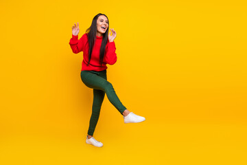 Full size photo of young happy excite funky funny positive girl dancing enjoying weekend isolated on yellow color background