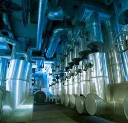 Equipment, cables and piping as found inside of a modern industrial power plant