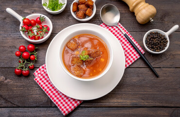 Homemade tomato soup with tomatoes, herbs and spices