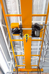 Overhead crane inside factory or warehouse. That industrial machinery or lifting equipment consist...