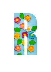 The letters R of the English alphabet is cut out of flowers on a blue  background.Floral pattern, texture for stores,sales,websites,postcards and holiday greetings.