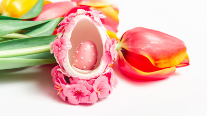 Happy easter. Congratulatory Easter background. Easter eggs and flowers.