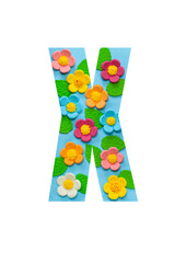 The letters X of the English alphabet is cut out of flowers on a blue background. Floral pattern, texture for stores, sales, websites, postcards, and holiday greetings.