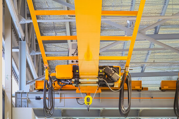 Overhead crane inside factory or warehouse. That industrial machinery or lifting equipment consist...