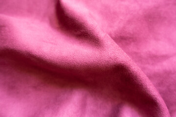 Ruby colored faux suede fabric in soft folds