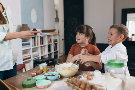 mother scold children for mess they made in kitchen