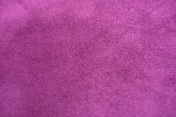 Fototapeta na wymiar Bright magenta colored faux suede fabric from above