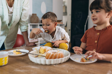 children eating cakes at home