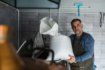 man working in mini craft brewery