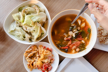 Thai food with tom yum mushroom , stir fried cabbage and Thai omelet