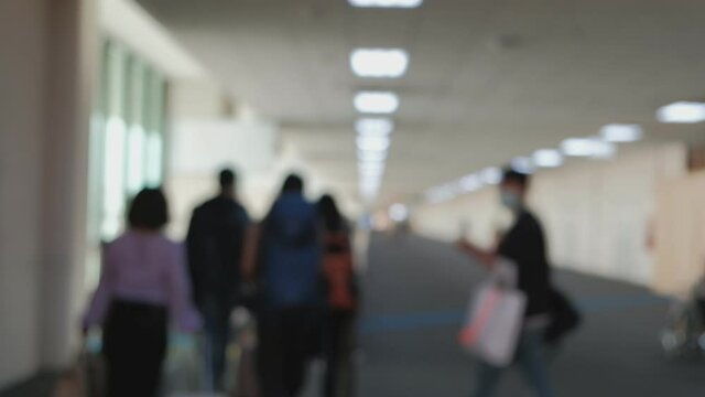 blurry wide footage: People hurrying at the boarding gate at Don Mueang Airport. Travel to destinations in various locations. passengers were spaced due to preventive measures for Covid-19 disease.
