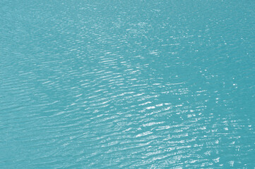 Bright, colorful background close up, turquoise green water surface lake, outdoors