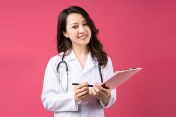 Young asian female doctor with cheerful expression on background