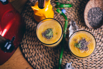 Obraz na płótnie Canvas Glasses of orange chia seed pudding 