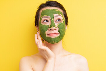 Young girl masked to exfoliate, beautify herself