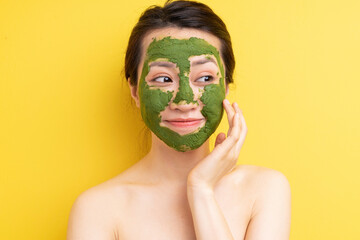 Young girl masked to exfoliate, beautify herself