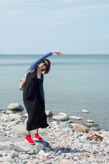 Woman on the beach doing exercises