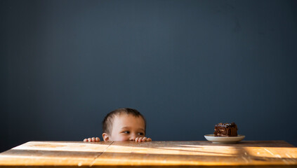 Little boy wants to eat cake, selective focus