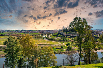 Fototapeta na wymiar Spectacular Landscape Of Nature With Views Of The Guadiana River And The Alcazaba Of Badajoz-Extremadura With A Dramatic Sky. Landscapes And Nature. Aerial View
