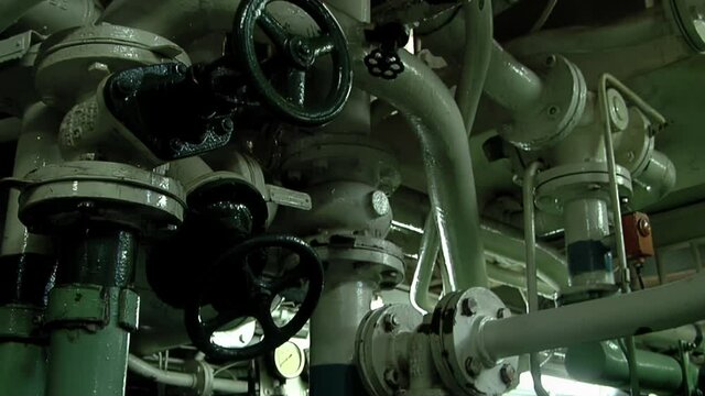 Valves and Pipes in the Engine Room of a Tugboat.  