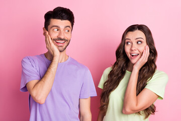Portrait of nice attractive amazed cheerful couple good news reaction isolated over pink pastel color background