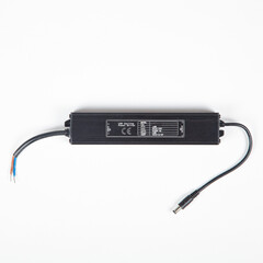 LED driver power supply ac adapter in black housing with barrel connetor on white background