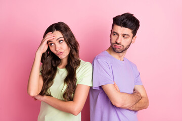 Profile side view portrait of attractive offended serious couple standing back to back fight isolated over pink pastel color background