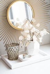 Beautiful white home interior decoration with vases and mirror