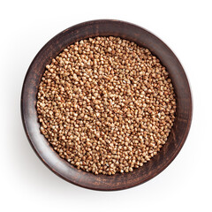 Uncooked roasted buckwheat in ceramic bowl isolated on white background with clipping path