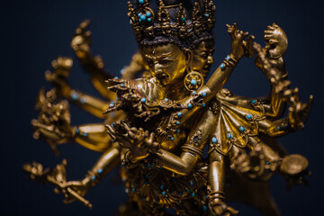 Yab-Yum, golden statue of deities and buddhas in amorous intercourse with his wife