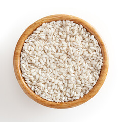 Uncooked arborio rice in wooden bowl isolated on white background with clipping path