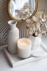 Obraz na płótnie Canvas Luxurious white tray decoration, home interior decor with burning candle