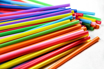 Colorful plastic drinking straws close up