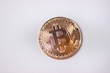 Physical bitcoin coin. Bitcoin on white background. Bitcoin cryptocurrency on white canvas.