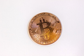 Physical bitcoin coin. Bitcoin on white background. Bitcoin cryptocurrency on white canvas.