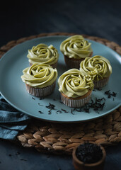 Cupcakes topped with green tea buttercream