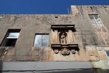 house with a religious statue in rabat in malta 