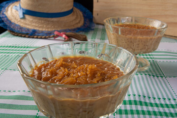 Festa junina in Brazil, Arroz doce, a typical Brazilian sweet made from rice and burnt sugar, black background, Selective focus.