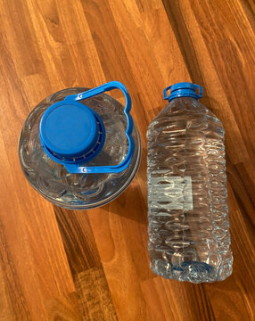 water canister on a wood parguet background