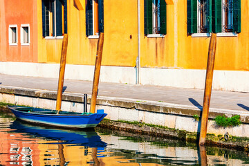 Blue gondola morred at the canals in Venice, Italy