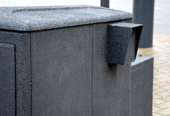 structural paint white, against stickers and illegal advertising on poles in urban space. sand...