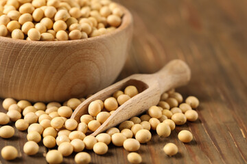 Soy on wooden table, closeup. Space for text