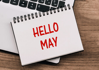 Text Hello May on a business notebook on a notepad. Business concept