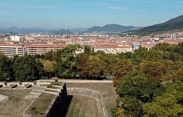 Pamplona old citty walls with mountains and modern houses on the background.