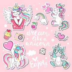 Obraz na płótnie Canvas Collection of cartoon unicorns and lettering Dream like a unicorn. Modern patch badges. Funny animals for birthday