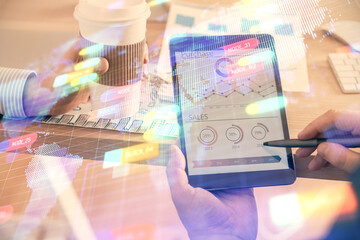 Multi exposure of man's hands holding and using a digital device and data theme drawing. Innovation concept.