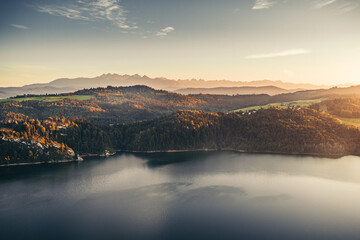 Sunset landscape with mountains and lake