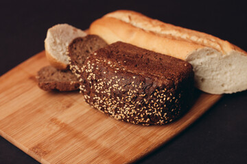 flour products on a wooden board baking loaf of bread