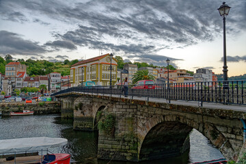 View of Ponte Vella historic bridge over river Mandeo in the picturesque town of Betanzos in the Galicia region of Spain.