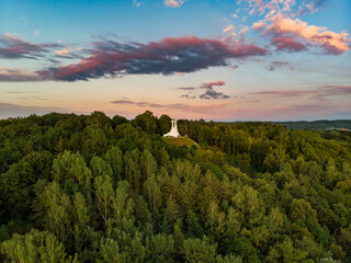 Aerial view of the Three Crosses monument overlooking Vilnius Old Town on sunset. Vilnius landscape from the Hill of Three Crosses, Kalnai Park, Lithuania